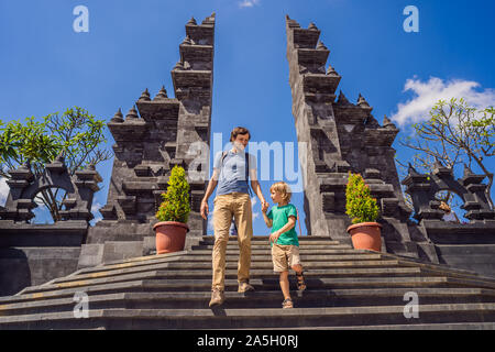 Dad and son tourists in budhist temple Brahma Vihara Arama Banjar Bali, Indonesia. Honeymoon Stock Photo