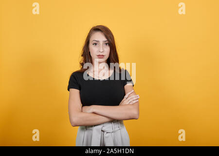 Rude girl standing and waiting to ask someone who made her unhappy. Stock Photo