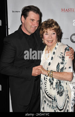 LOS ANGELES, CA. July 21, 2012: Brendan Coyle & Shirley MacLaine at photocall for the third series of Downton Abbey at the Beverly Hilton Hotel. © 2012 Paul Smith / Featureflash Stock Photo