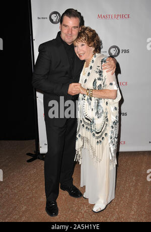 LOS ANGELES, CA. July 21, 2012: Brendan Coyle & Shirley MacLaine at photocall for the third series of Downton Abbey at the Beverly Hilton Hotel. © 2012 Paul Smith / Featureflash Stock Photo