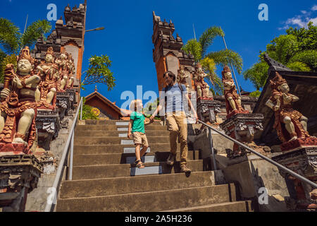 Dad and son tourists in budhist temple Brahma Vihara Arama Banjar Bali, Indonesia Stock Photo