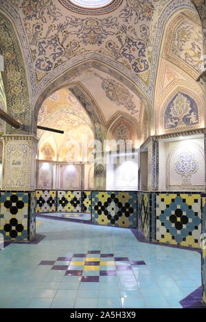 IRAN, KASHAN - 5 OCTOBER, 2019: Interior of traditional iranian Sultan Amir Ahmad bathhouse with ceramic tiles and beautiful colorful murals with flor Stock Photo