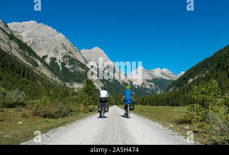 Cyclists in the Karwendel valley, way to the Karwendelhaus, Tyrol, Austria Stock Photo