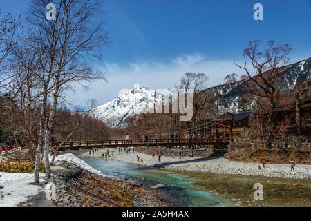 Bridge over Azusa River, Mount Yake, Japanese Alps, Kamikochi, Matsumoto, Nagano, Japan, snow covered in the background Stock Photo