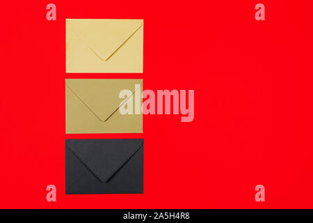 Junk mail or spam and fake letter idea. Concept for unsolicited mail or e-mail. Set of closed envelopes on red background Stock Photo