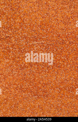 Flecked old rusty metal surface yellow and orange color. Closeup macro view of pattern texture or background taken in natural environment Stock Photo