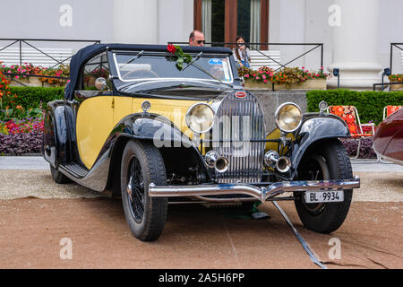 BADEN BADEN, GERMANY - JULY 2019: yellow black BUGATTI TYPE 57 cabrio roadster 1934, oldtimer meeting in Kurpark. Stock Photo