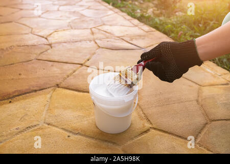 painting concrete tiles yellow close up Stock Photo