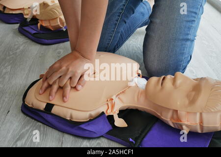 cpr training. close-up of trainee's hand pump on chest of dummy on CPR First Aid Training course for primary safe life Stock Photo