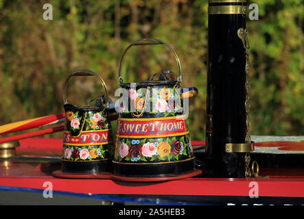 Canal narrowboat water jugs decorated with the traditional roses design. Stock Photo