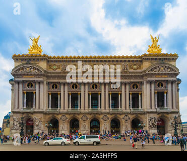 Close panoramic view of the main façade on the south of the famous Palais Garnier or Opéra Garnier in Paris with the two gilded figural groups,... Stock Photo