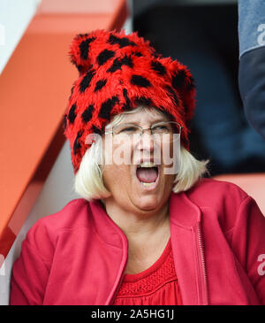 In the red a Bournemouth fan during the Premier League match between AFC Bournemouth and Norwich City at the Vitality Stadium Stadium , Bournemouth , 19 October 2019 -  Editorial use only. No merchandising. For Football images FA and Premier League restrictions apply inc. no internet/mobile usage without FAPL license - for details contact Football Dataco Stock Photo