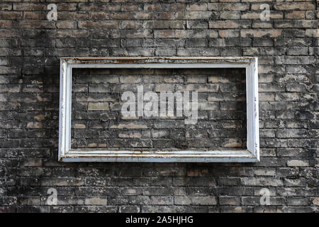 Empty frame on brick wall in Trastevere, Rome Stock Photo