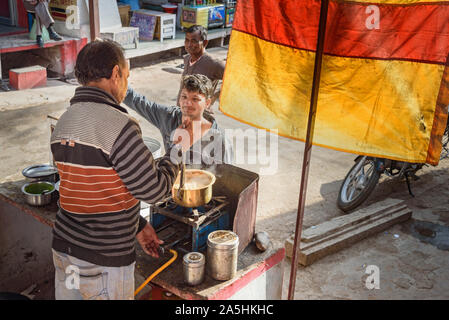 Bikaner, India - February 11, 2019: Indian menmake indian milk tea or chai on the street in Bundi. Rajasthan Stock Photo