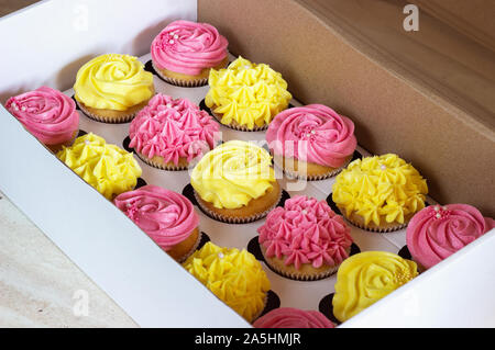 Delicious cupcakes in cardboard box . Stock Photo