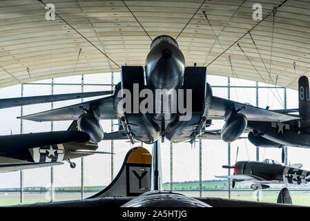 American Air Museum Duxford Cambridge - Aircraft hanging from the roof of the American Air Museum at the IWM Duxford. McDonnell Douglas F-15A Eagle Stock Photo