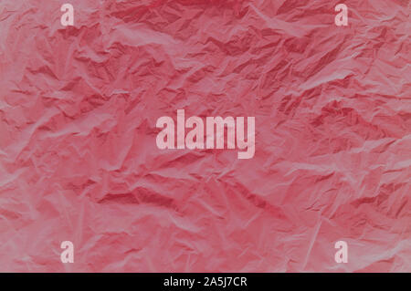 Abstract background. Crumpled fabric in red. Background image of crumpled fabric. Stock Photo