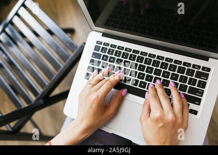 Closeup hands typing on laptop keyboard. Stock Photo