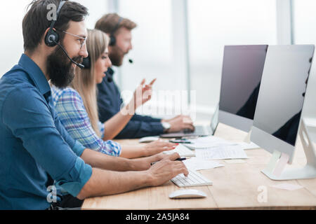 employees on computers at work