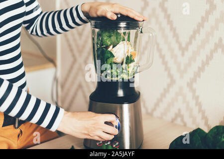 A large blender bowl whips the ingredients for a smoothie. Stock Photo