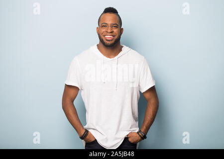 Smiling african America man in glasses posing in studio Stock Photo