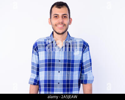 Portrait of happy young bearded Persian hipster man Stock Photo