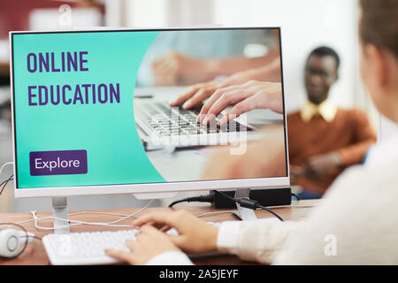 Online education website design with unrecognizable student using computer in college, copy space Stock Photo