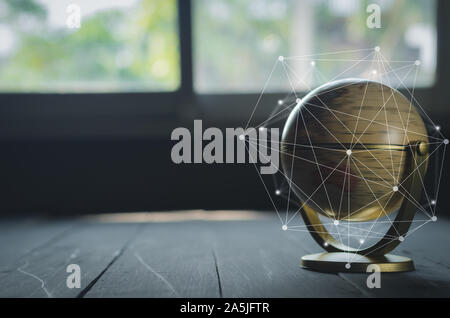 spinning globe on black table with hand drawing grid line Stock Photo