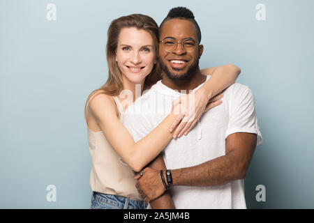Portrait of smiling multiethnic couple posing for picture Stock Photo