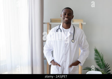 Portrait of biracial male doctor in uniform at hospital Stock Photo
