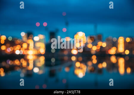Oslo, Norway. Night Abstract Boke Bokeh Background Effect. Design Backdrop. Night View Embankment And Residential Multi-storey House In Gamle Oslo Dis Stock Photo