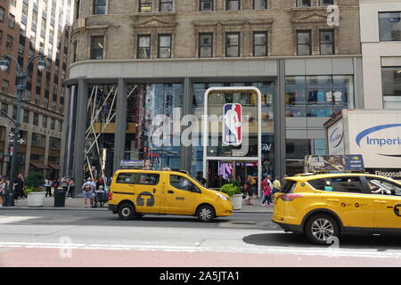 New York, USA. 14th Sep, 2019. Yellow taxis drive past the NBA Store on Fifth Avenue in Manhattan. The shop carries merchandise of the team of the National Basketball Association (NBA) and Womens National Basketball Association (WNBA). Credit: Alexandra Schuler/dpa/Alamy Live News Stock Photo