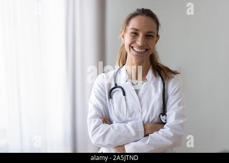 Portrait of smiling female nurse posing in hospital Stock Photo