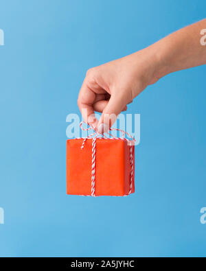 Christmas background with small present in red box Stock Photo
