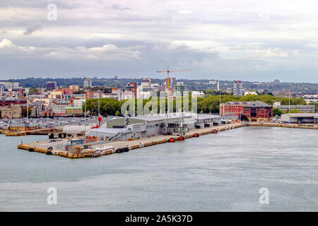 Leaving the docks on a cruise ship, looking at the dock area and the city view beyound,, Southampton, Hampshire, UK. Stock Photo