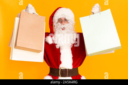 Santa Claus holding shopping bags from wow sales day Stock Photo