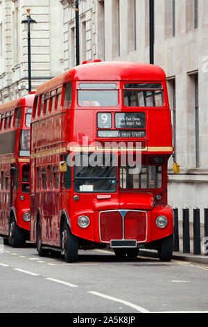 Iconic red AEC Routemaster  double-decker buses parked on a street in Central London UK