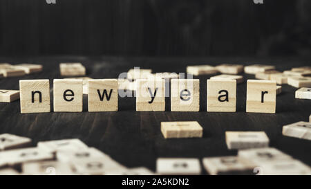 New Year Concept - ‘ New Year’ written on wooden blocks, close up Stock Photo