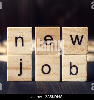 New Job written on wooden alphabet blocks, close up Stock Photo