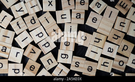 Alphabet letters on wooden scrabble pieces, from above Stock Photo