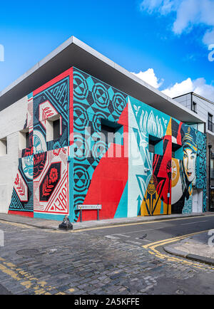 New giant mural designed and produced by Shepard Fairey on Whitby Street, London Stock Photo
