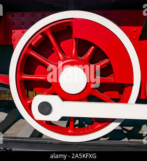 Red wheels of an old railway locomotive. Retro transport. Transport. Stock Photo