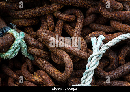 A close up of rusty chains and rope Stock Photo