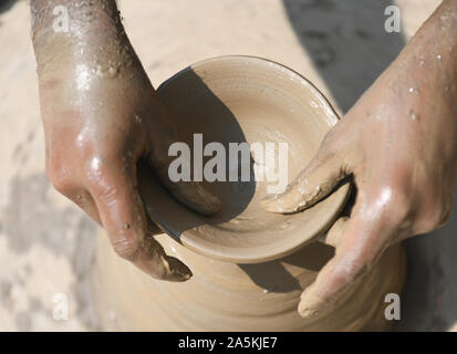 A potter prepares clay lamp or diya on potter's wheel in his residence ahead of Diwali festival in Beawar, Rajasthan. Photo/Sumit Saraswat Stock Photo