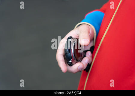 Stopwatch timer a in man s hand. Man's hand with a stopwatch Stock Photo