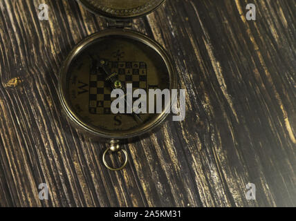Old chess compass on the table Stock Photo