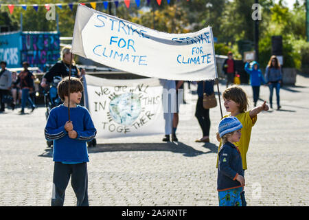 Children carrying a banner participating in the Extinction Rebellion climate strike in Truro City City in Cornwall. Stock Photo