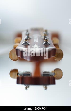 Bright white acoustic guitar reflection taken in England. Stock Photo