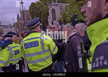 Westminster, London, UK. 21st October 2019. Brexit remain and leave campaigners gathered and exchanged heated comments outside the Palace of Westminster again today as MP's continued to debate Brexit. G.P. Essex/Alamy Live News. Stock Photo