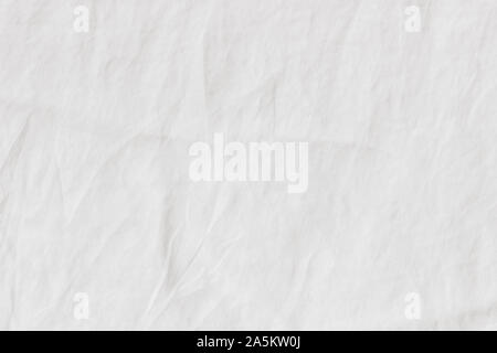 White crinkle linen texture, closeup of fabric, tablecloth or bed linen. Light empty copy space. Stock Photo